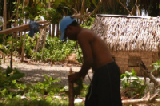 0342_marshall_islands_shucking_coconuts